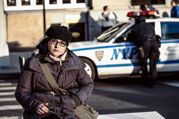 Woman on Manhattan Bench with Phone