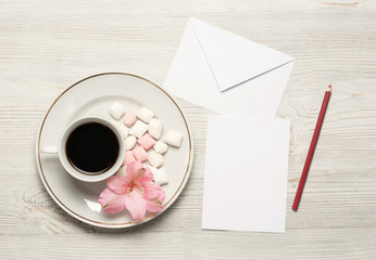Flowers composition. Cup of coffee, dried flowers and leaves. Top view, flat lay