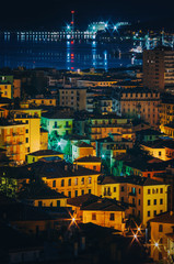 Night panoramic overview of La Spezia city, Italy. Picturesque scene with illuminated colorful buildings. Beautiful travel postcard.