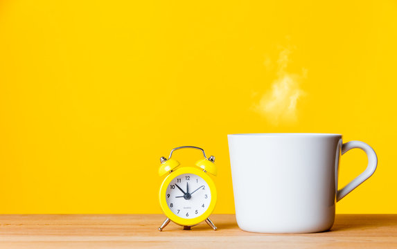 alarm clock and cup of coffee