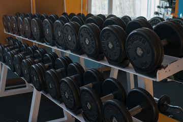 Obraz na płótnie Canvas barbells and free weights at the modern gym