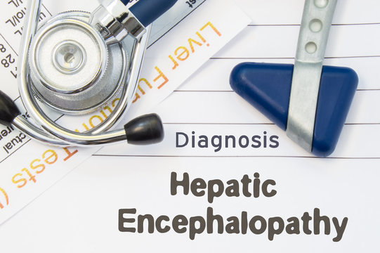 Diagnosis Hepatic Encephalopathy. Neurological hammer, stethoscope and liver laboratory test lie on note with title of Hepatic Encephalopathy. Concept for neurology and gastroenterology