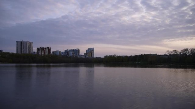 Evening city river spread the water surface. Iset river, Ekaterinburg, Sverdlovsk oblast, Russia.