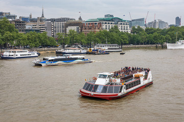 A pleasure cruiser on the River Thames, London, England, U.K