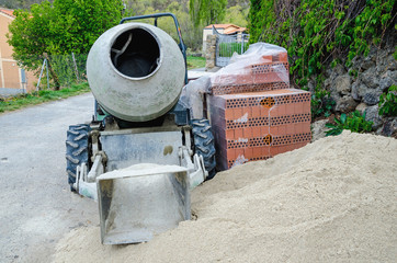 porable cement mixer placed in the street