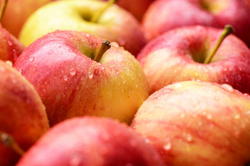 many red apples, fresh fruit background in market