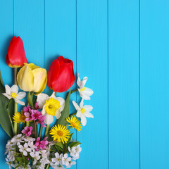 Tulips on a wooden background