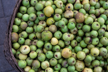 Green apples on the organic traditional food market of tropical Bali island, Indonesia. Sukawati market. Apples background.