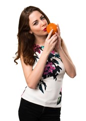 Beautiful young girl holding oranges