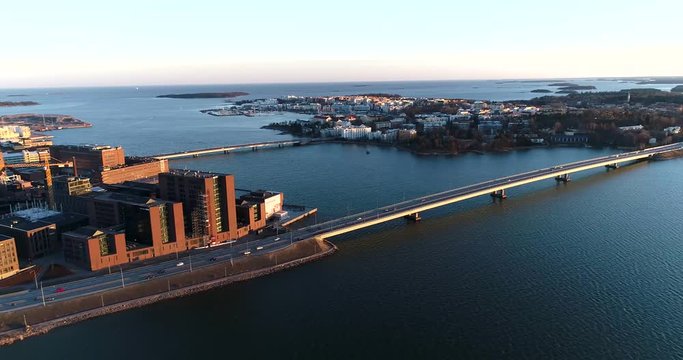 Lapinlahti bridge, Cinema 4k aerial pan view of cars on lapinlahden silta, on a sunny spring evening, in Ruoholahti, Helsinki, Finland