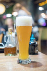 Glass of beer with blur background
