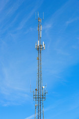 Phone mast against blue sky