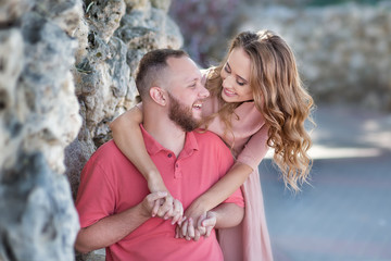 Young fashion couple of lovers at beginning of love story - Handsome man whispers sexy kisses in...
