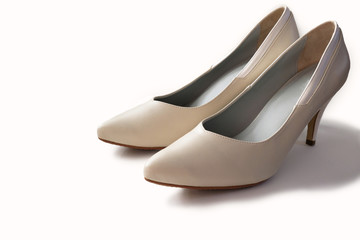 White leather high heels isolated on white background