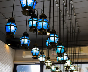 Classic blue glass ceiling lamps in the restaurent