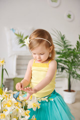 happy toddler girl with flowers