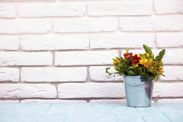 bouquet of flowers in a bucket