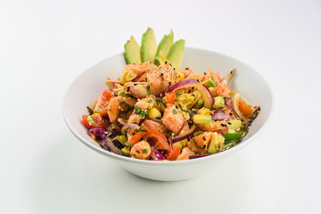 Mix japanese salad with salmon, tomato, avocado and onion. Asian food