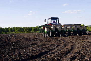 Tractor cultivating land for planting
