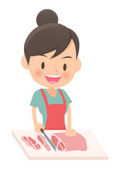料理をする主婦　肉を切る