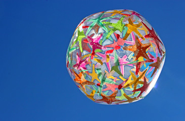 colorful beach ball  against the blue sky