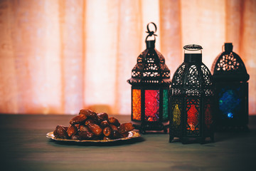 The Muslim feast of the holy month of Ramadan Kareem. Beautiful background with a shining lantern Fanus. Free space for your text.