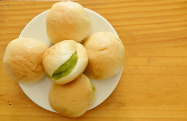 bun stuffed sweet custard cream on dish