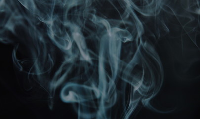 smoke floating without direction on black background