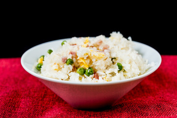 Homemade Chinese fried rice with vegetables and fried eggs