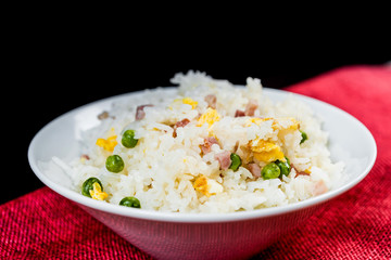 Homemade Chinese fried rice with vegetables and fried eggs