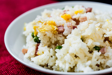 Homemade Chinese fried rice with vegetables and fried eggs