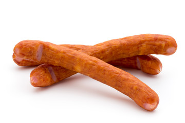 Stack of smoked sausages isolated on a white background.