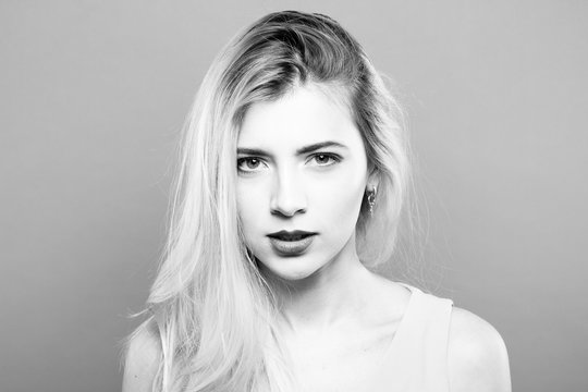 Black and White Portrait of Temperamental Sad Blonde Posing in Studio.