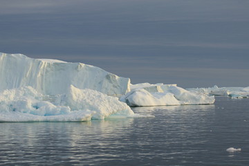 Glaciers at a midnight sun boat tour in Ilulissat, Greenland 