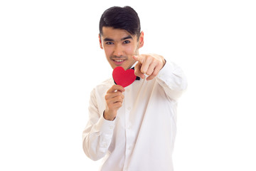 Young man holding a read heart 