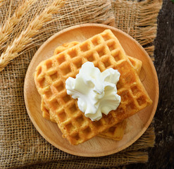 waffles honey syrup on wooden background