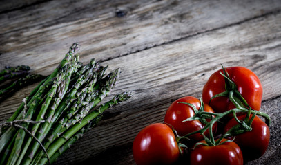 Brunch of Fresh Asparagus on vintage wooden background. place for text