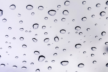 Raindrops on a car windshield after raining