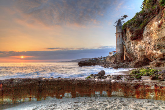Sunset over Pirates tower at Victoria Beach in Laguna Beach