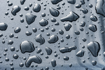 texture of raindrops on a car surface after raining