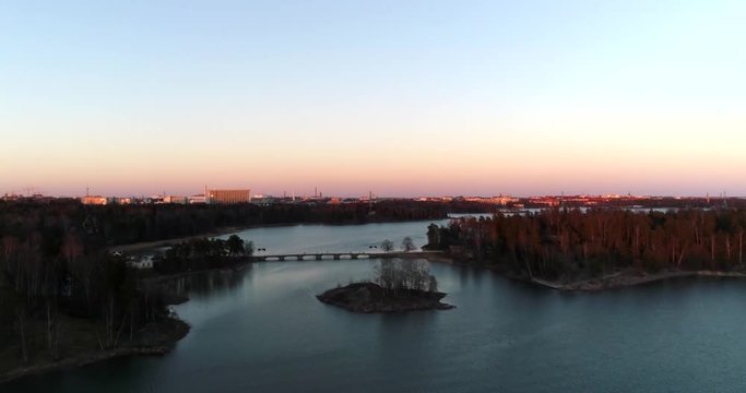 Seurasaari bridge, Cinema 4k aerial view of a flight towards, seurasaaren silta, on a sunny spring evening, in Helsinki, Finland