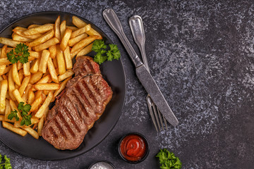 Beef barbecue steak with french fries.