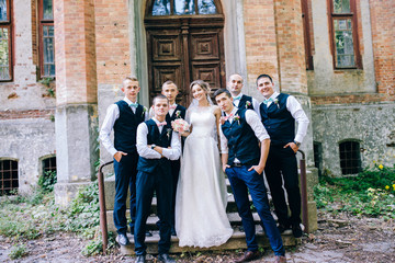 Beautiful bride with groomsmen