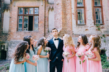 Groom with pretty bridesmaids