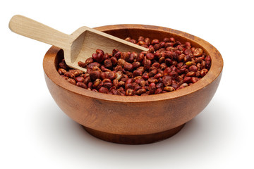 Sumac berries in wooden bowl with scoop