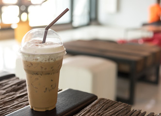 Iced coffee with caramel syrup and whipped cream