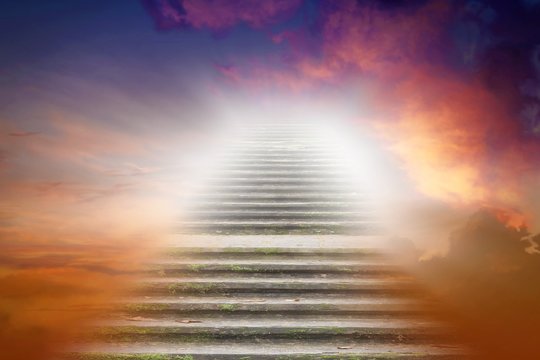 Stairs in sky .  Religion for the person . Way to heaven . Road to Paradise . Way to God . bright light from heaven . 