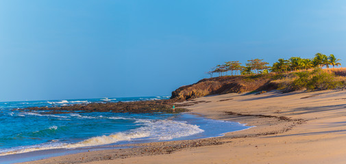 Obraz premium Guanacaste, Costa Rica - April 5, 2017: Beautiful Playa Mansita beach and oceanscape at low tide. This location is a development of Hacienda Pinilla and use by guests of the JW Marriott Guanacaste 