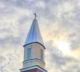 Top of the church against a cloudy sky