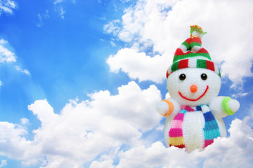 snowman in blue sky with white clound.(Christmas concept)